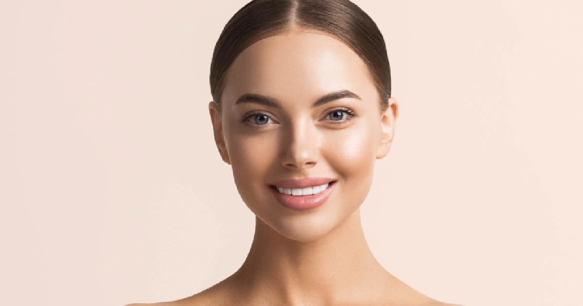 Woman with glowing, youthful skin smiling confidently representing the results of chemical peels in Lee's Summit, MO.