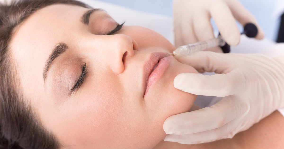 Woman receiving a lip flip treatment in Lee's Summit, MO for subtle, natural lip enhancement.